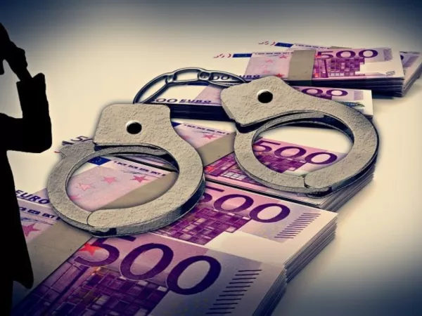 Bundles of Euro bank notes overlaid by handcuffs and a sinister sillouetted character on the left.