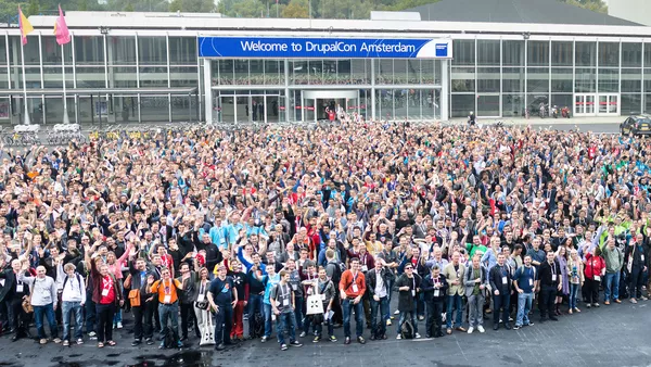 Thousands of drupal developers and users pose for a photograph outside of the RAI centre in Amsterdam for the 2014 DrupalCon.