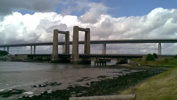 The Kingsferry Bridge, looking West from the Isle of Sheppey, with the more modern Sheppey Crossing behind.