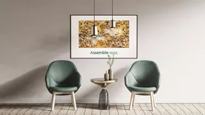 A well designed room featuring a large piece of wall art featuring a bee hive and the Pivale Assemble: Multisite Solutions branding.