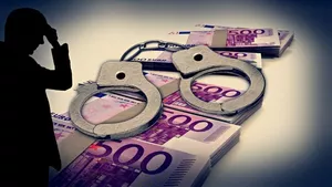 Bundles of Euro bank notes overlaid by handcuffs and a sinister sillouetted character on the left.