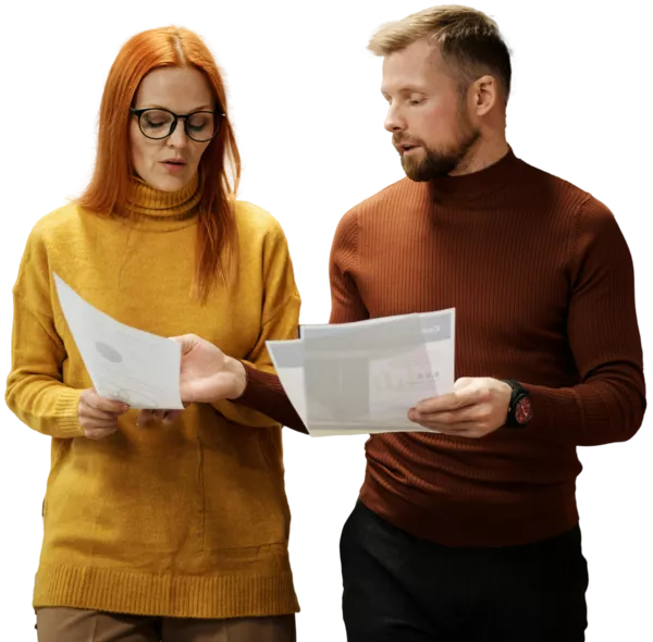A man and woman reviewing some design notes.