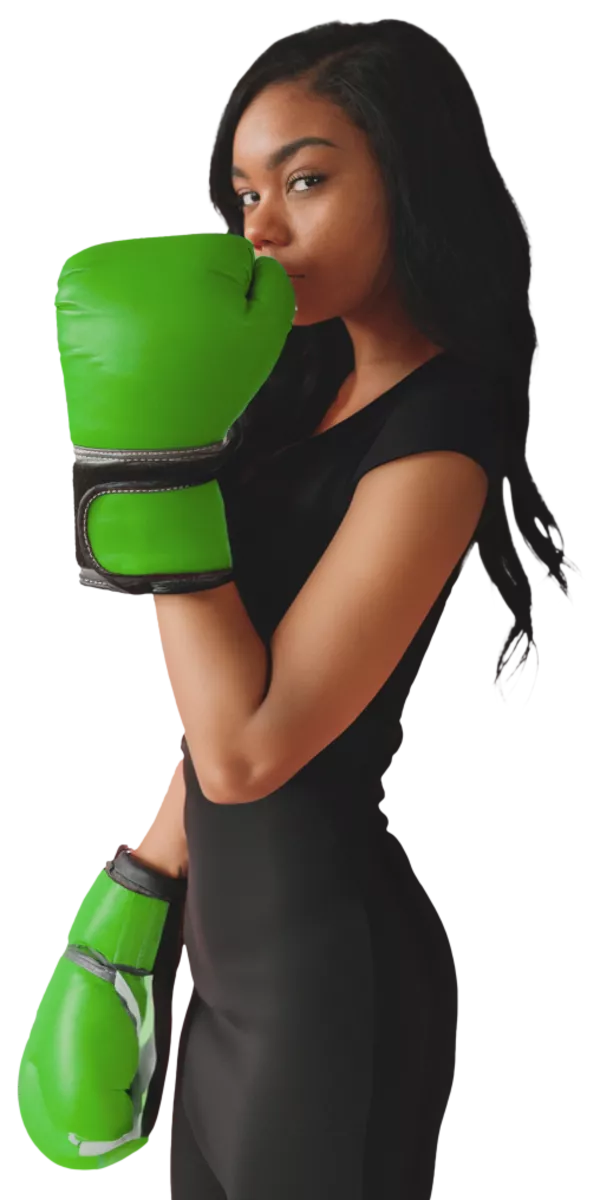 A woman wearing green boxing gloves.