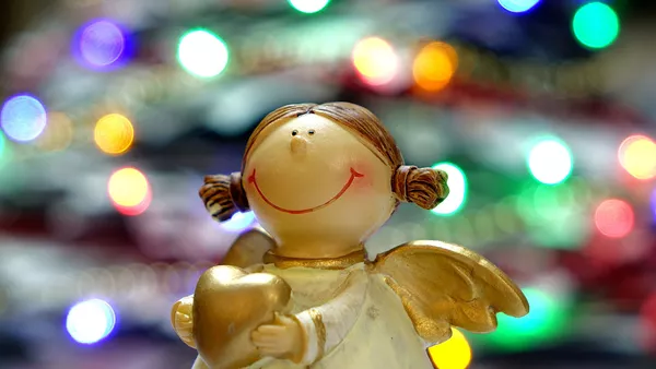 An angel figurine representing the perfect customer.