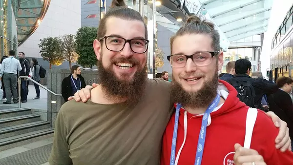 Bart Feenstra and Darren Fisher in Dublin - two young men with long hair in &apos;top knots&apos;, thick rimmed glasses and long beards.
