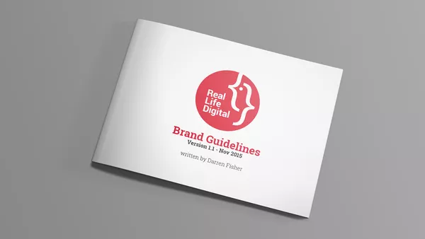 A closed copy of Real Life Digital&apos;s branding document showing the cover.