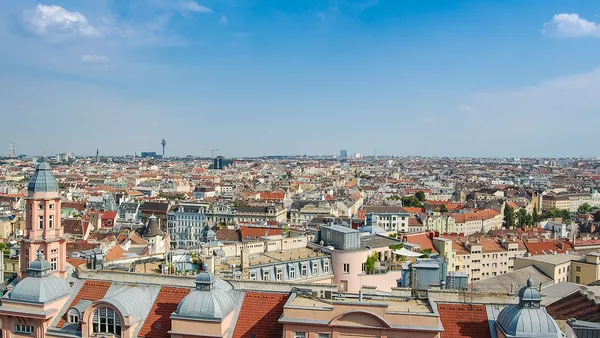 A view over the rooftops of Vienna with a beautiful blue sky overhead.