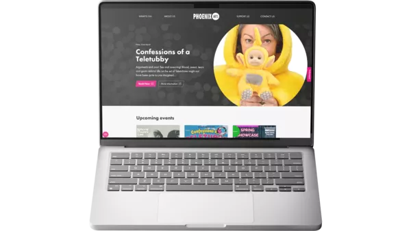 The Phoenix Arts website shown on a MacBook Pro.